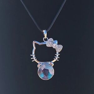 Super cute Amazonite, Amethyst, and Rose Quartz Hello Kitty with 24 inch cord